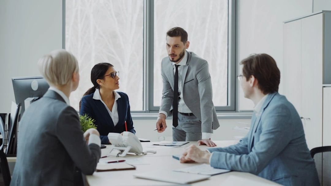 A professional business meeting in an office.